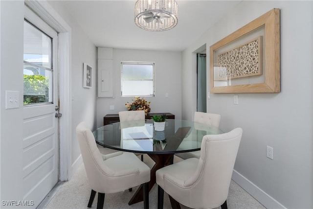 dining space featuring an inviting chandelier