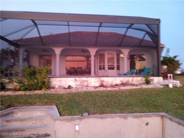 exterior space with a yard, a lanai, and a patio