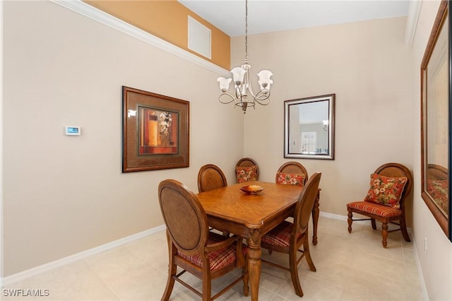 dining area with an inviting chandelier