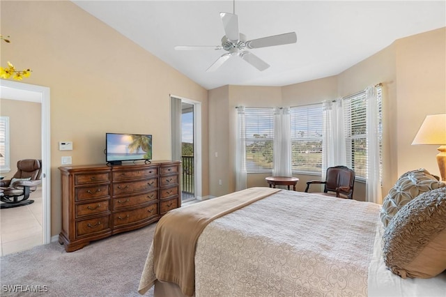 carpeted bedroom with vaulted ceiling, access to outside, and ceiling fan