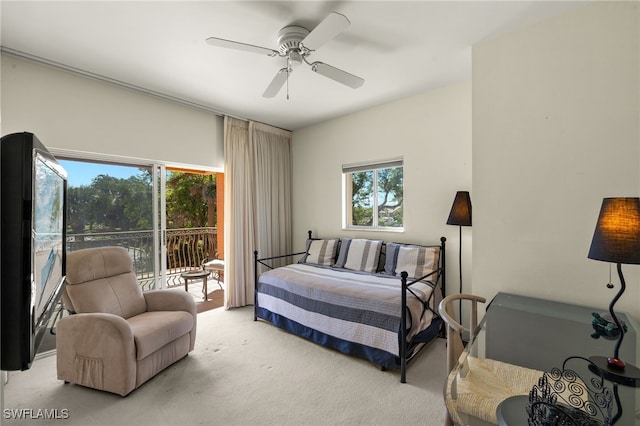 bedroom featuring light carpet, access to outside, and ceiling fan