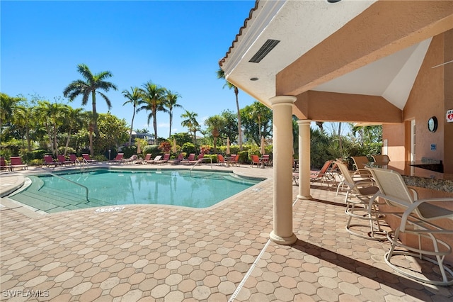 view of swimming pool featuring a patio