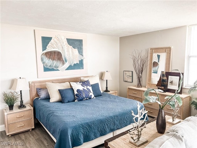 bedroom featuring dark hardwood / wood-style flooring