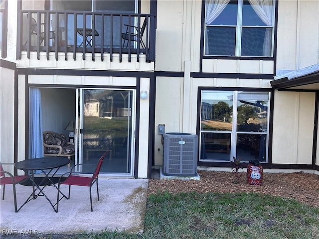 exterior space featuring a balcony and central AC unit