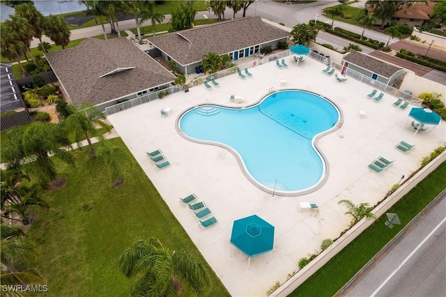 view of pool with a yard and a patio area