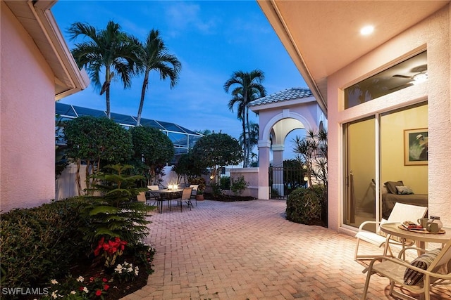 view of patio terrace at dusk