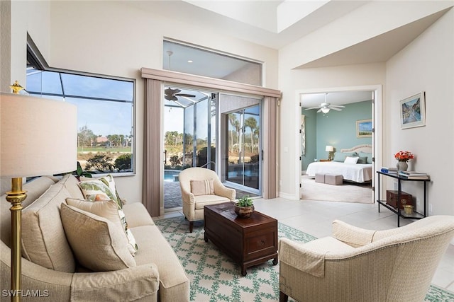 bedroom with light tile patterned floors and access to outside