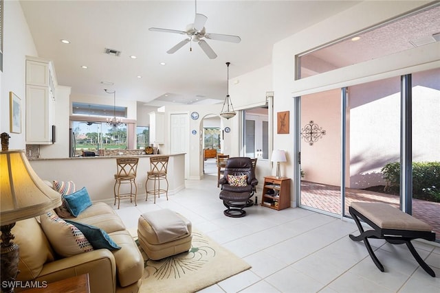 tiled living room featuring ceiling fan