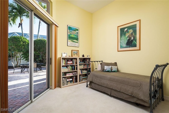 bedroom featuring carpet floors and access to exterior