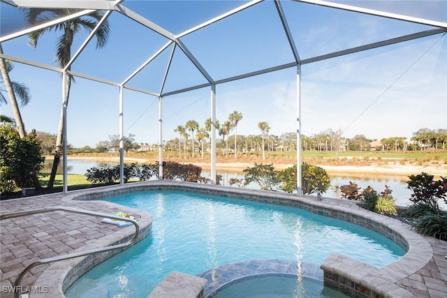 view of swimming pool featuring a patio area, an in ground hot tub, glass enclosure, and a water view