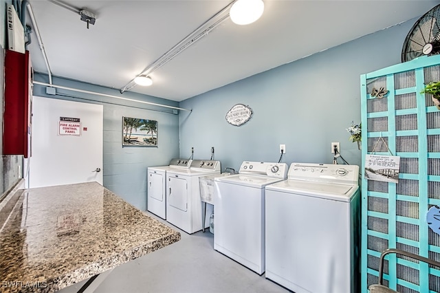 washroom with independent washer and dryer