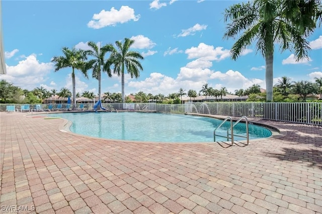 view of swimming pool featuring a patio area