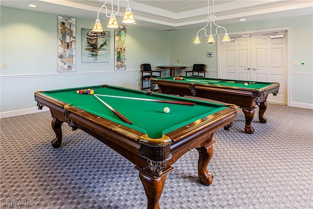 rec room with pool table, a tray ceiling, and carpet floors