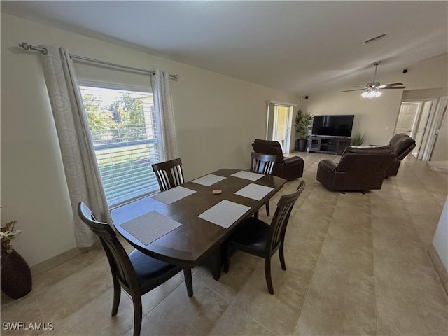 dining area featuring vaulted ceiling and ceiling fan