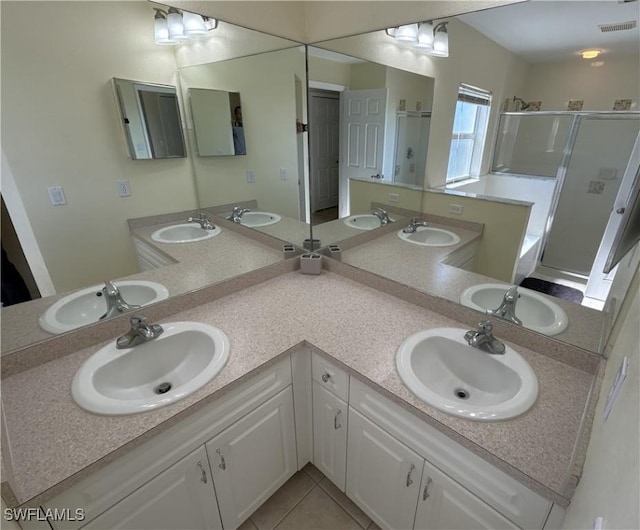 bathroom with vanity, separate shower and tub, and tile patterned floors