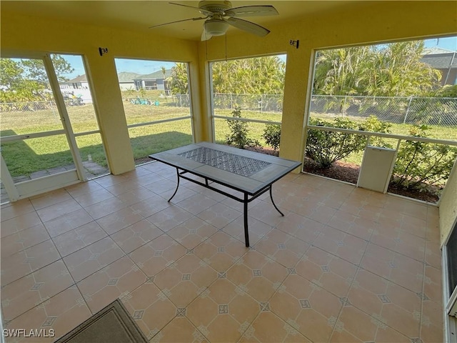 sunroom / solarium with ceiling fan