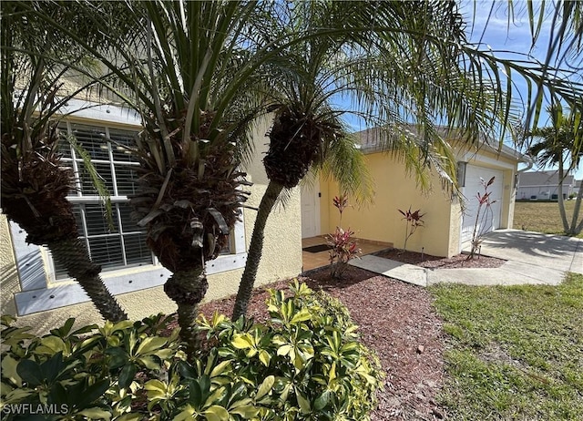 view of side of property with a garage