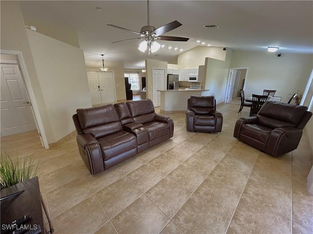 living room with high vaulted ceiling and ceiling fan