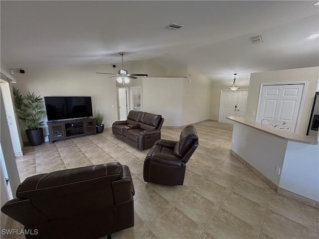 living room featuring ceiling fan and vaulted ceiling