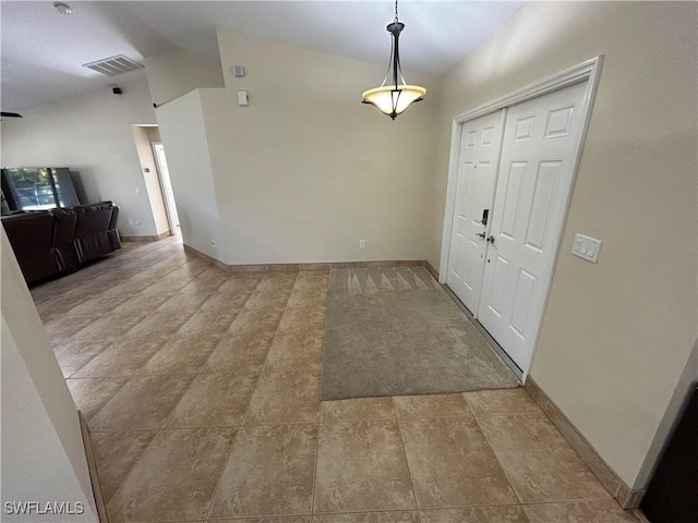 entryway featuring lofted ceiling