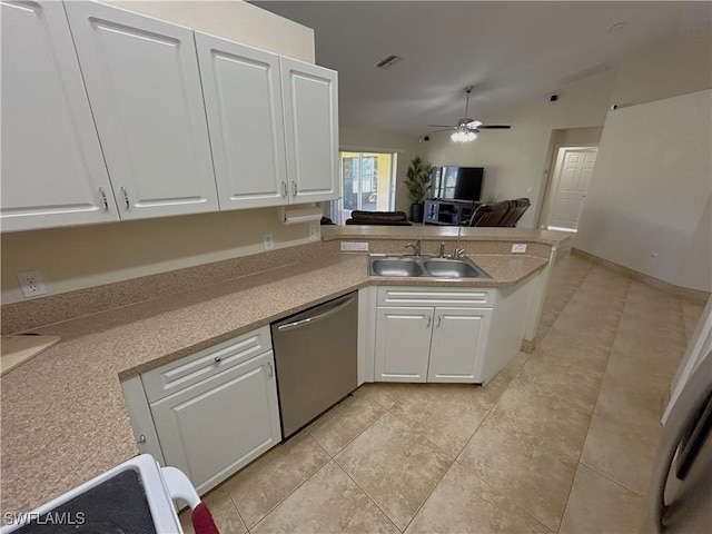 kitchen with white cabinetry, dishwasher, lofted ceiling, sink, and kitchen peninsula