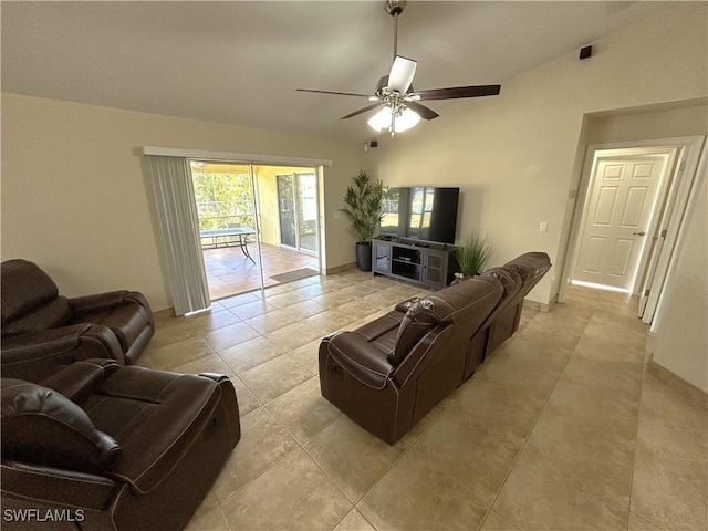 living room featuring lofted ceiling, light tile patterned floors, and ceiling fan