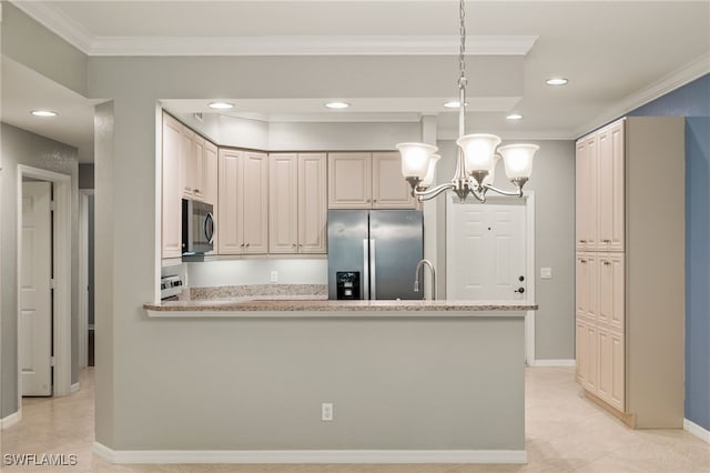 kitchen with pendant lighting, ornamental molding, stainless steel appliances, and light stone counters