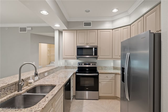 kitchen featuring sink, light stone counters, crown molding, light tile patterned floors, and stainless steel appliances