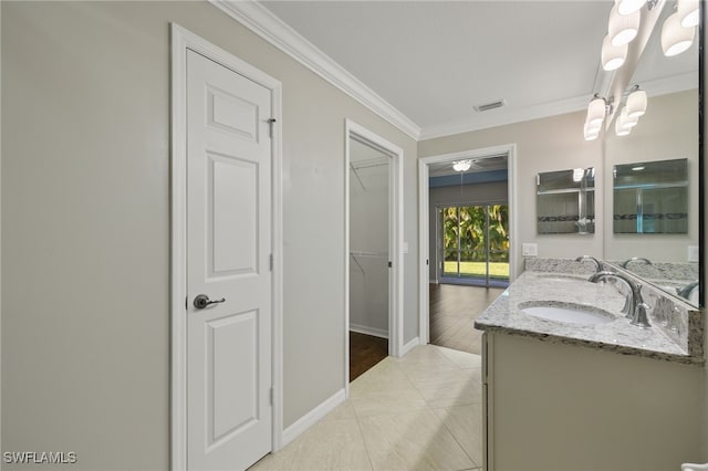 bathroom with vanity, tile patterned flooring, and crown molding