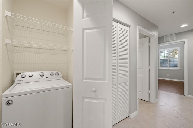 washroom with light tile patterned flooring and washer / clothes dryer