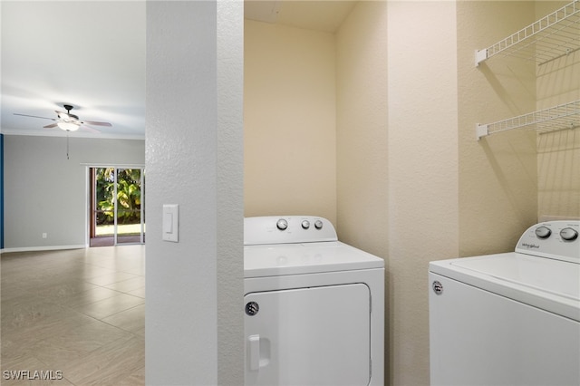 clothes washing area with ornamental molding, washing machine and clothes dryer, and ceiling fan