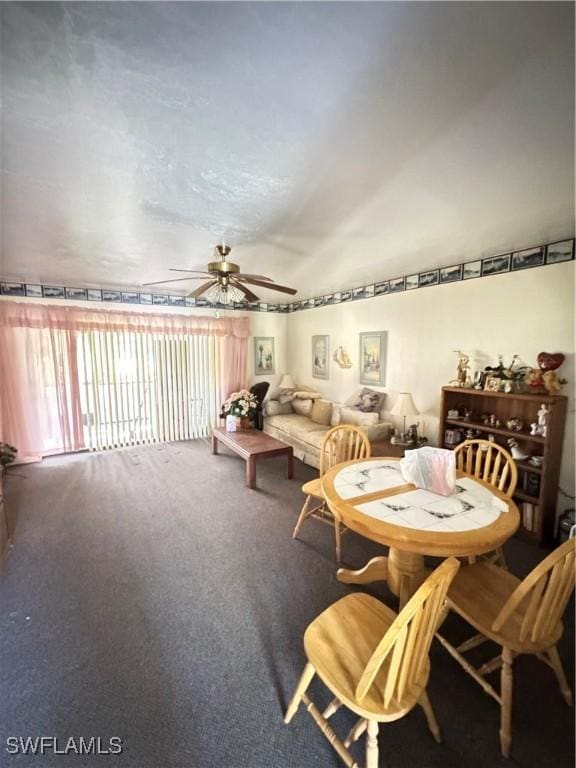 dining space with carpet flooring and ceiling fan