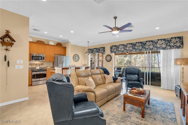 living room with light tile patterned floors, ornamental molding, and ceiling fan