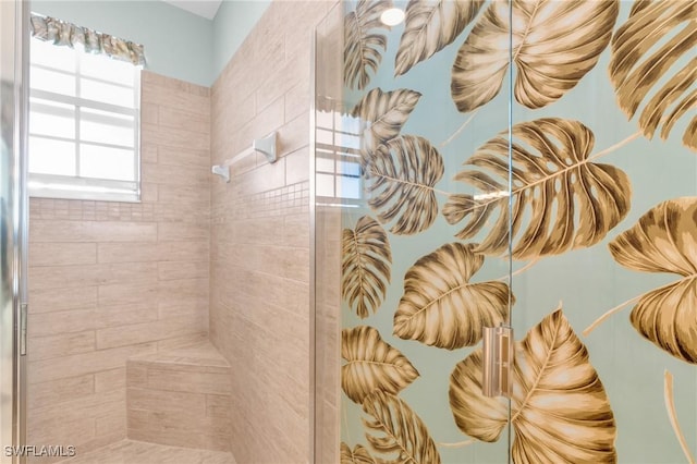 bathroom with tiled shower