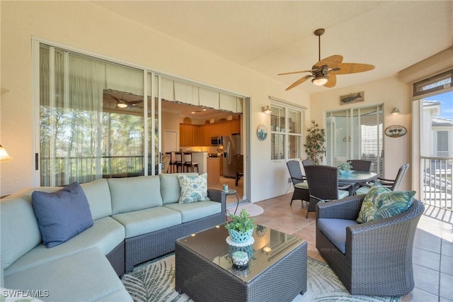 interior space featuring ceiling fan and light tile patterned floors