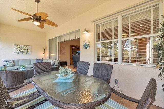 view of patio featuring outdoor dining area, an outdoor hangout area, and ceiling fan