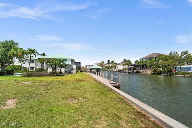 view of dock featuring a water view and a lawn