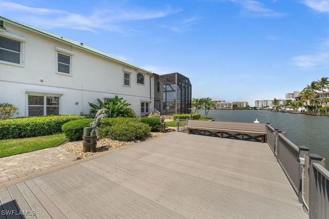 view of dock featuring a lanai and a water view