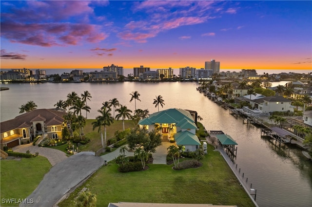 aerial view at dusk with a water view