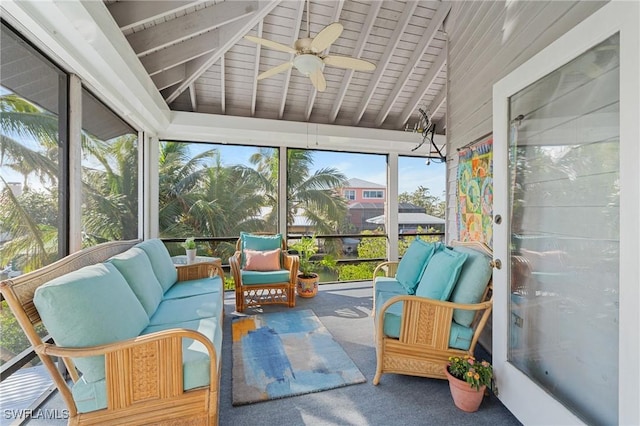 sunroom featuring vaulted ceiling and ceiling fan