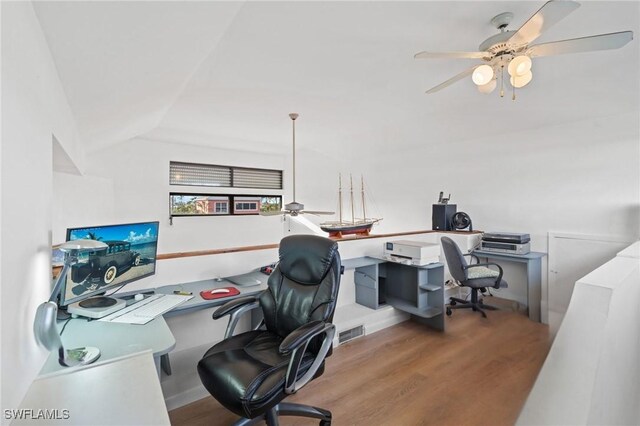 office space with wood-type flooring, lofted ceiling, and ceiling fan