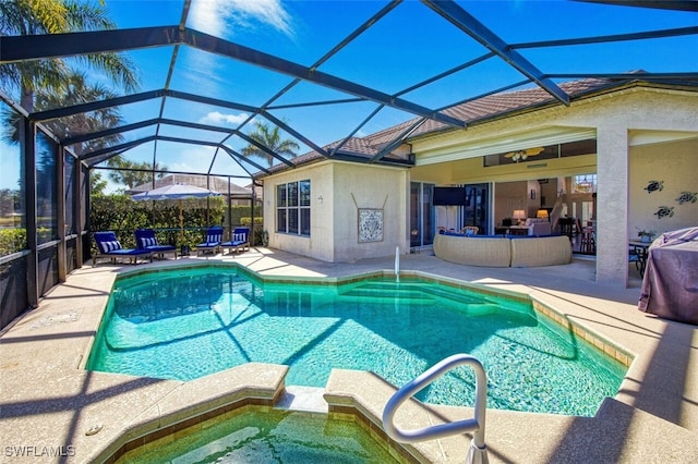 view of pool featuring a lanai and a patio