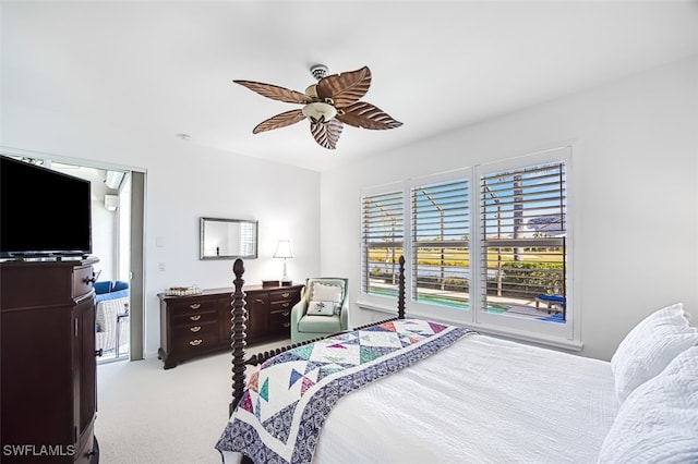 bedroom featuring light colored carpet and ceiling fan