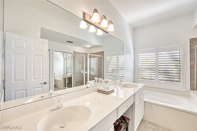 bathroom with vanity, shower with separate bathtub, and tile patterned flooring