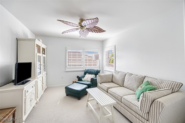 living room featuring light colored carpet and ceiling fan