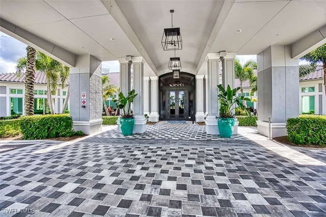 view of exterior entry featuring french doors