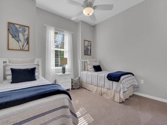 bedroom with ceiling fan and carpet flooring