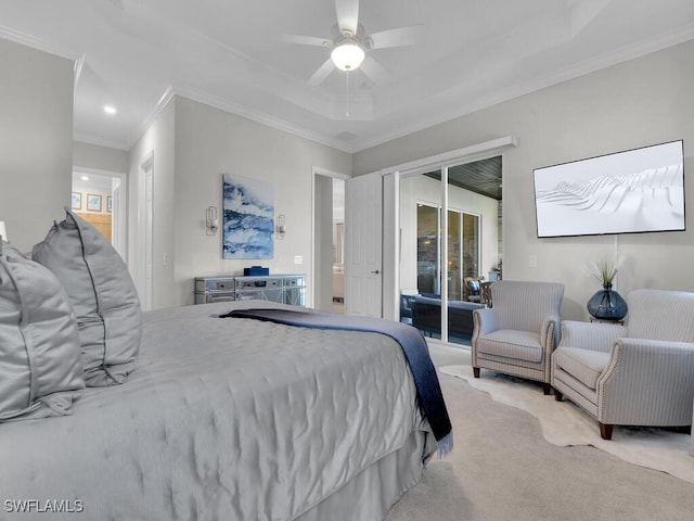 carpeted bedroom featuring a tray ceiling, crown molding, access to outside, and ceiling fan