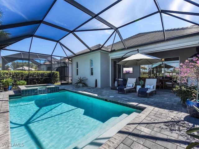 view of swimming pool featuring an in ground hot tub, a lanai, and a patio