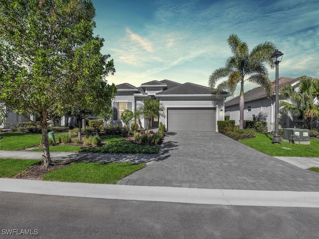 view of front of property with a garage